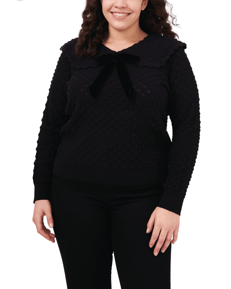 Front of a model wearing a size 1X Audriana Collared Bow Top Sweater in RICH BLACK by CeCe. | dia_product_style_image_id:263979